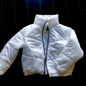 Brand new white puffer with black accents.  Never worn!